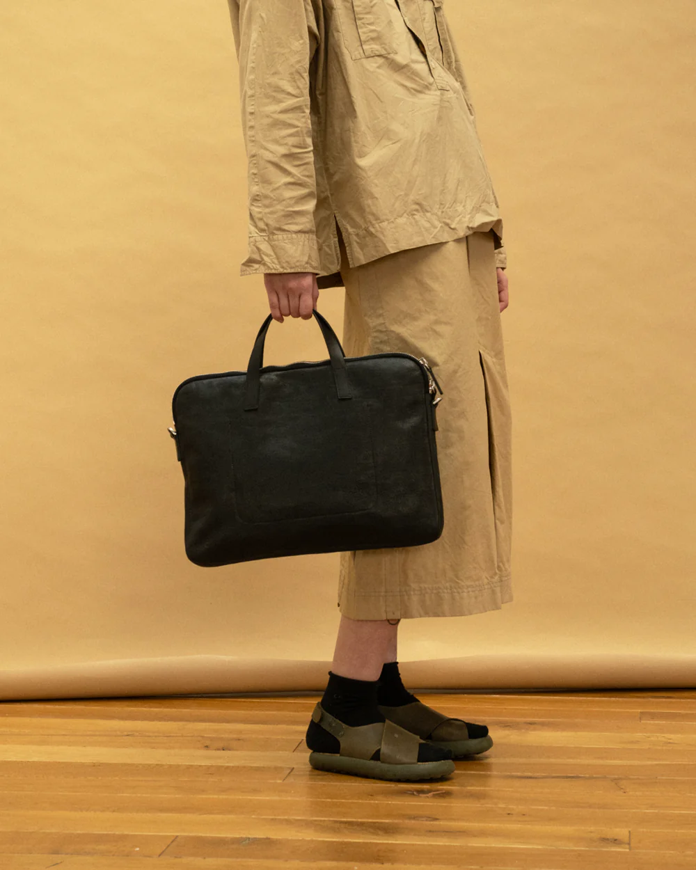 A Velmoray bag carried by hand